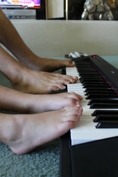 Playing-piano-together-feet